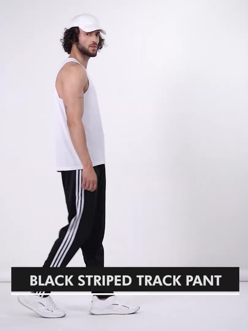 Adidas track pants online black stripes